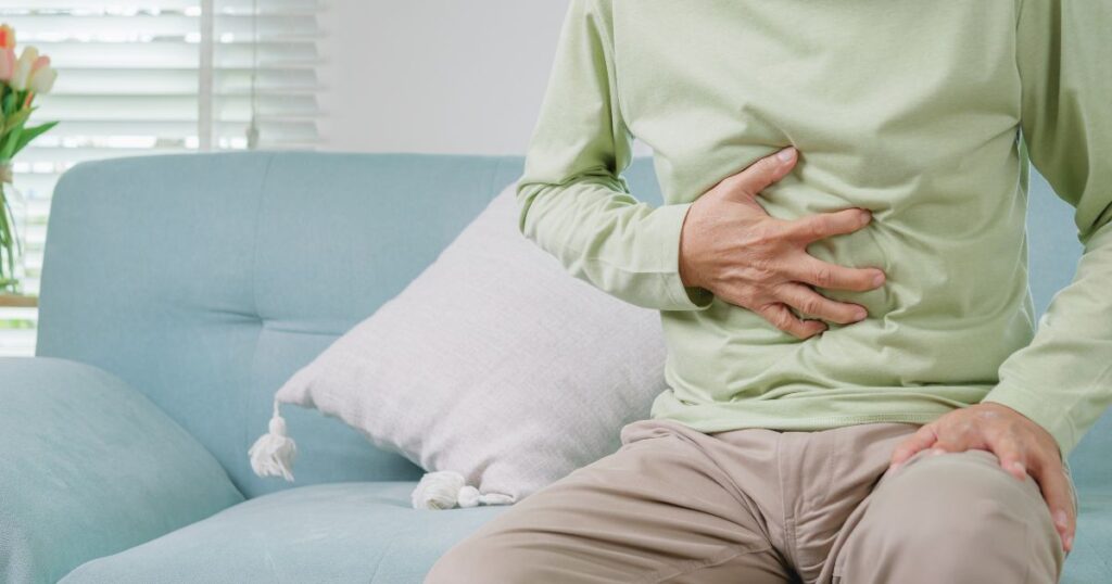 representação de alguém com dor de estômago